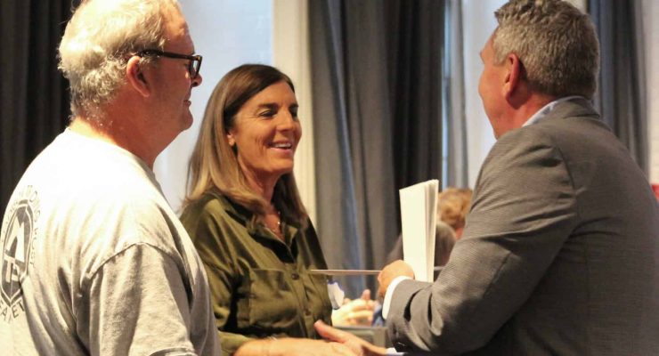 Rod Asher (left) and Cheryl Lyon with Canaan Events & Enrichment Foundation, Inc. smile with appreciation while accepting their $30,000 grant award from CFMJC President & CEO Bill Barnes.